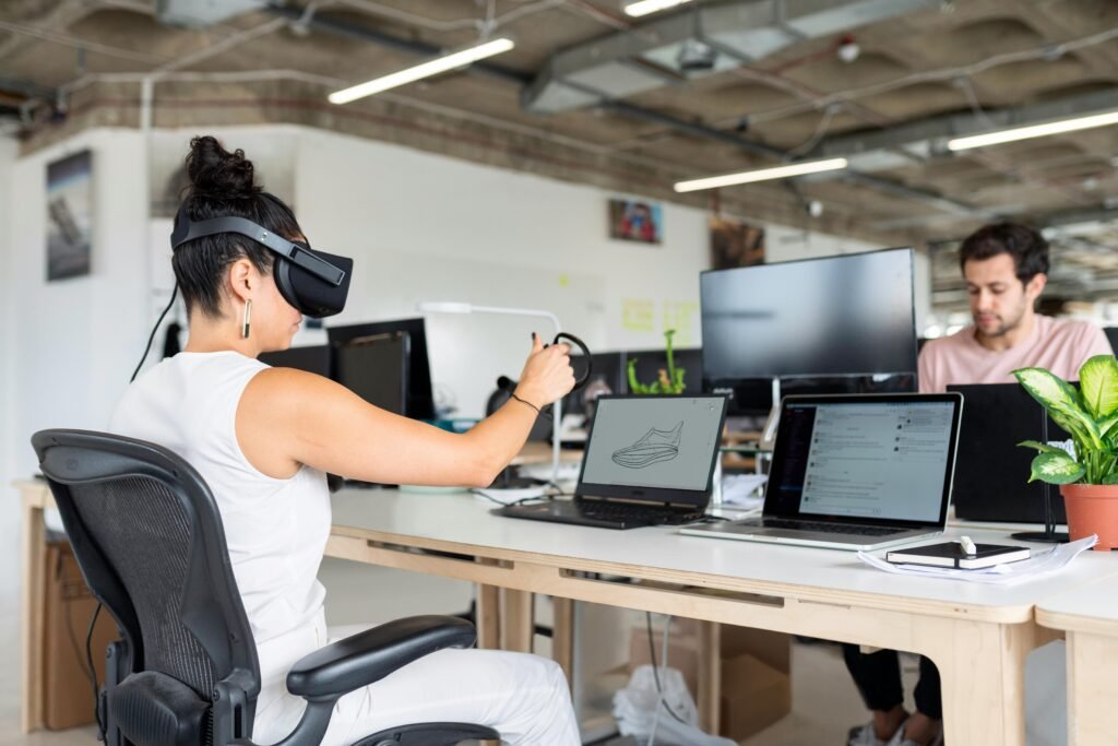 Woman using virtual reality headset in a modern office for design and innovation.